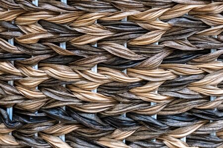 weaving from a colored vine. handmade wickerwork pattern.の写真素材