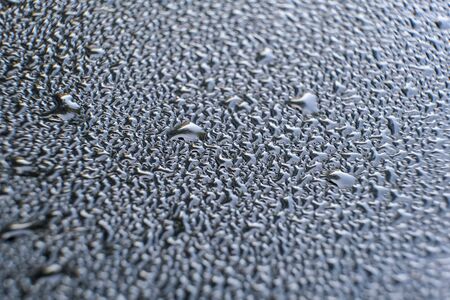 drop of water on a car glass. abstraction.の写真素材