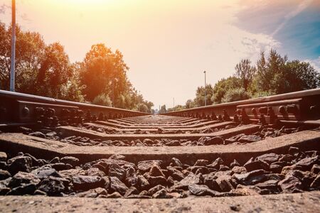 Close-up of a railway with detail of the rails in the sunny day in summer.の写真素材