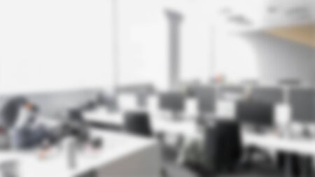 Blurred empty open space office. Abstract light bokeh at office interior background for design.