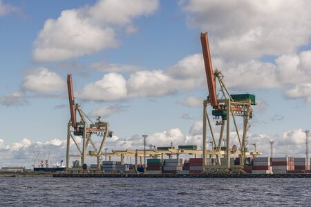 Cargo freight port with industrial cranes. Container ship in import and export business logistic...