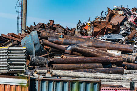 large pile of collected scrap metal for recycling on the territory of the metal collection point.