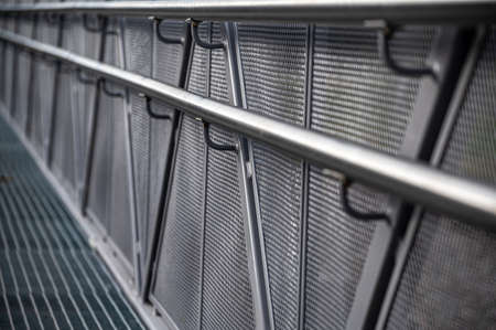 Perspectives of modern metal railings. Galvanized fence with railings. Selective focus.