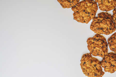 Homemade oatmeal cookies on a white background, top view. Delicious sweet breakfast, healthy food. cookie background.の写真素材