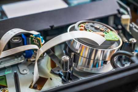 steel shiny round rotating video head for playing video cassettes. VCR tape transport mechanism...