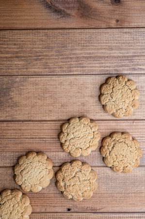 fresh oatmeal cookies on a wooden background, confectionery.の写真素材