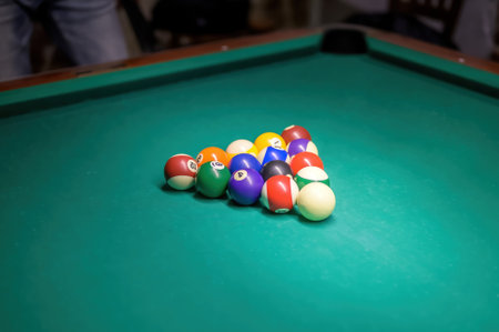 Billiard balls on the table for the game. Pool table set up for start.の写真素材