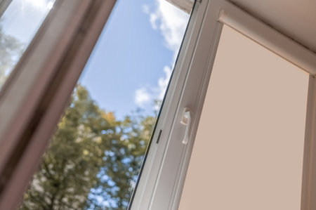 open white pvc plastic window. Airing the room on a fine summer day.