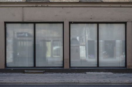 Facade of a boutique shop with large windows and a place for a name. closed shop.の写真素材