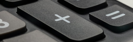 Close-up of the numeric keypad of a calculator. Scientific calculator buttons.