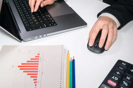 business woman clicking wireless computer mouse laptop computer on office desk.