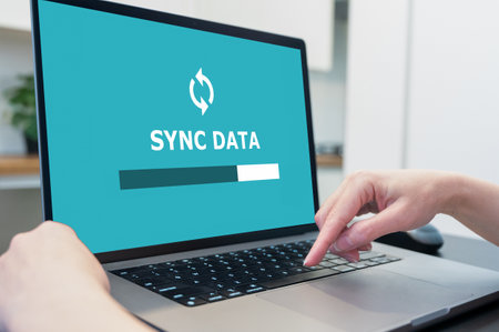 Laptop with data sync on screen. secure online backup to the cloud.の写真素材