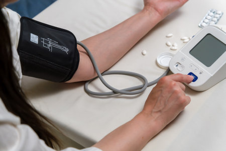 woman measures blood pressure. arterial hypotension. hand and tonometer close-up.の写真素材