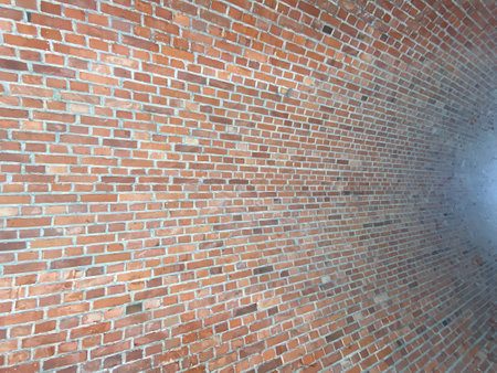 brick red wall. background of a old brick house.の写真素材