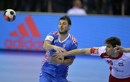 CRACOV, POLAND - JANUARY 27, 2016: Men's EHF European Handball Federation EURO 2016 Krakow Tauron Arena Poland Croatia
o/p: Domagoj Duvnjak Piotr Chrapkowskiのeditorial素材