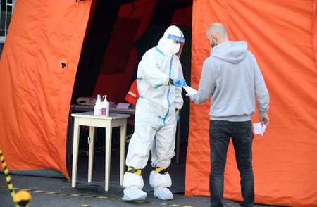 Warsaw, Poland, April 23, 2020: Warsaw during COVID-19 epidemic, coronavirus testing point in front...