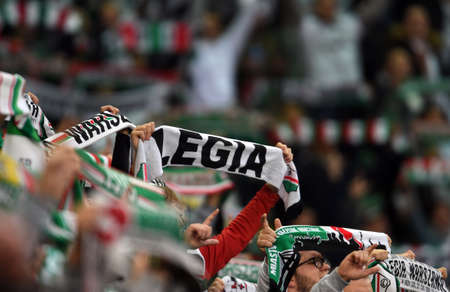 WARSAW, POLAND - OCTOBER 17, 2021: Polish Football League game Legia Warszawa - Lech Poznan, Legia supportersのeditorial素材