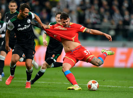 WARSAW, POLAND - NOVEMBER 04, 2021: UEFA Europa League group Stage game Legia Warsaw - SSC Napoli, Mateusz Wieteska (Legia Warsaw) Andrea Pategna (SSC Napoli)のeditorial素材