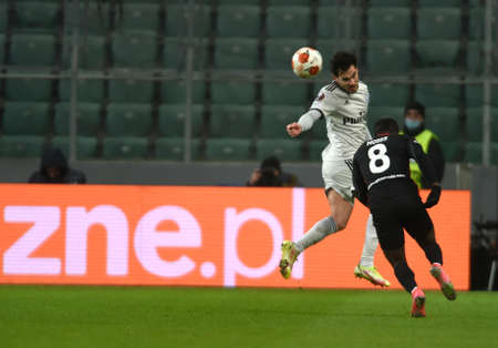 WARSAW, POLAND - DECEMBER 09, 2021: UEFA Europa League group Stage game Legia Warszawa - FC Spartak Moscov, Victor Moses (FC Spartak Moskva) Yuri Ribeiro (Legia Warsaw)のeditorial素材