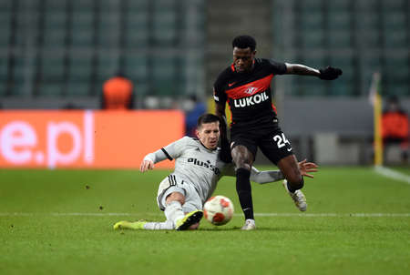 WARSAW, POLAND - DECEMBER 09, 2021: UEFA Europa League group Stage game Legia Warszawa - FC Spartak Moscov, Lirim Kastrati (Legia Warsaw) Quincy Promes (FC Spartak Moskva)のeditorial素材