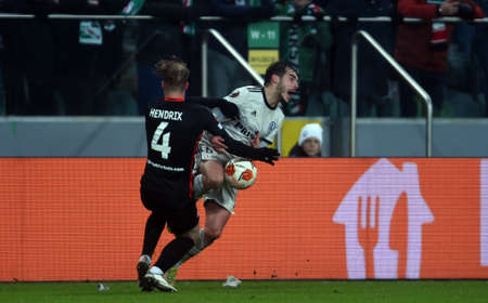 WARSAW, POLAND - DECEMBER 09, 2021: UEFA Europa League group Stage game Legia Warszawa - FC Spartak Moscov, Jorrit Hendrix (FC Spartak Moskva) Yuri Ribeiro (Legia Warsaw)のeditorial素材
