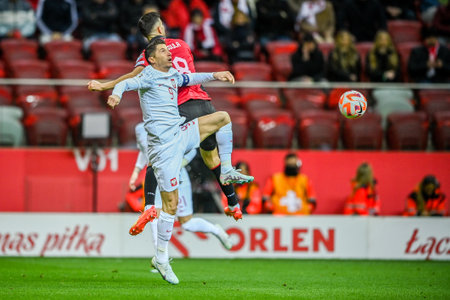 WARSAW, POLAND - MARCH 27, 2023: European qualifiers EURO 2024 group stage Poland - Albania o/p: Klaus Gjasula (Albania) Robert Lewandowski (Poland)のeditorial素材