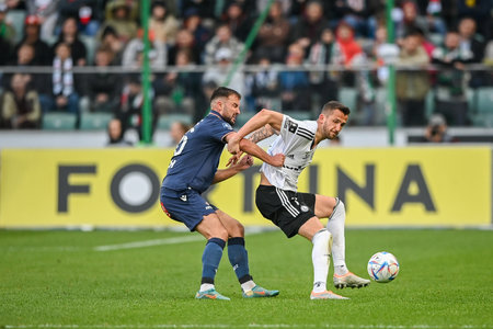 WARSAW, POLAND - APRIL 16, 2023: Polish Football League T-Mobile Ekstraklasa o/p: Antonio Milic (Lech) Tomas Pekhart (Legia)のeditorial素材