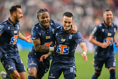WARSAW, POLAND - APRIL 16, 2023: Polish Football League T-Mobile Ekstraklasa o/p: Alfonso Sousa (Lech) goal celebration with Afriel Ba Loua (Lech)のeditorial素材