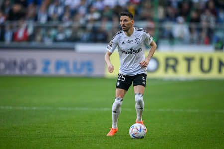 WARSAW, POLAND - APRIL 16, 2023: Polish Football League T-Mobile Ekstraklasa o/p: Filip Mladenovic (Legia)のeditorial素材