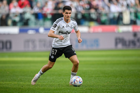 WARSAW, POLAND - APRIL 16, 2023: Polish Football League T-Mobile Ekstraklasa o/p: Bartosz Kapustka (Legia)のeditorial素材