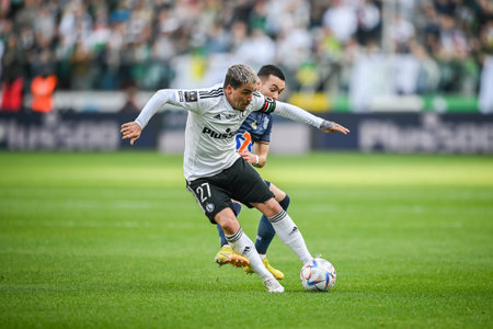 WARSAW, POLAND - APRIL 16, 2023: Polish Football League T-Mobile Ekstraklasa o/p: Alfonso Sousa (Lech) Josue (Legia)のeditorial素材