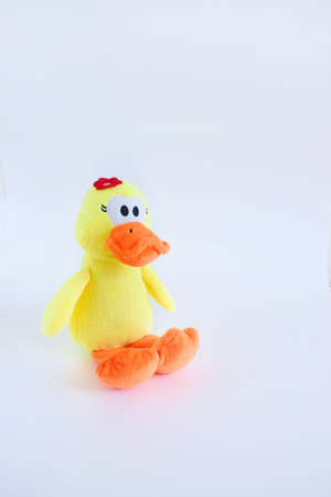 Children Toy collection, Soft yellow Duck soft toy isolated on the white background. Copy space.