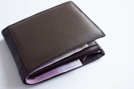 top view brown leather wallet isolated on white background.