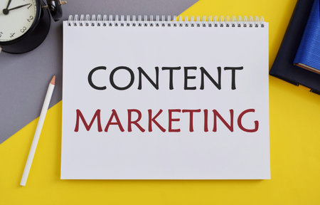 Content Marketing writen in Notebook. Concept meaning involves creation and sharing of online materialの写真素材