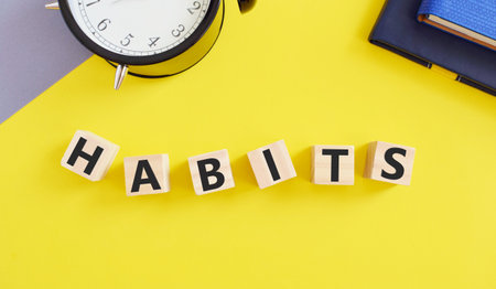 Word writing text Habits on wooden blocks .Business concept for Regular tendency or practice Routine...