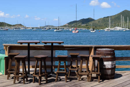 Sint Maarten, Caribbean. March 31st 2020. Normally busy, these seats with a view are empty at the...