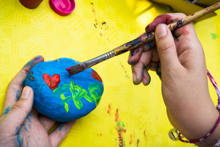 stone decoration with paint and brushの写真素材