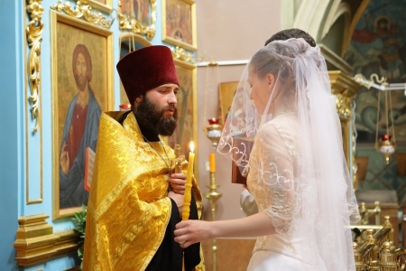 MOSCOW - AUGUST  04: Not identified people take part in wedding Christian orthodox church ceremony at Tsaritsino Cathedral on August 04, 2007 in Moscow.のeditorial素材