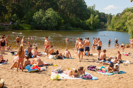 MOSCOW - AUGUST 03: People resting and swimming in Moskva river beach at Serebryany Bor on August 3, 2014 in Moskva. Serebryany Bor is the large forest park in North-west Moscow.のeditorial素材