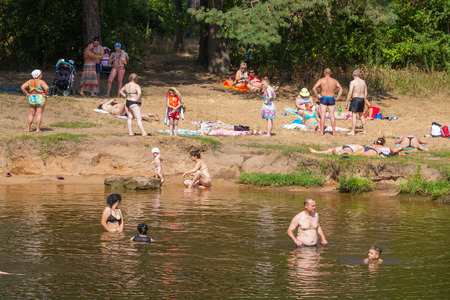 MOSCOW - AUGUST 03: People swimming and relaxing on the beach in the Serebryany Bor on August 3, 2014 in Moscow. Serebryany Bor is the large forest park in North-west Moscow.のeditorial素材