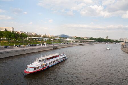 MOSCOW, RUSSIA - MAY 17, 2018: River ships on the Moscow River near Zaryadye Park. Zaryadye Park is landscape urban park located adjacent to Red Square in Moscow.のeditorial素材