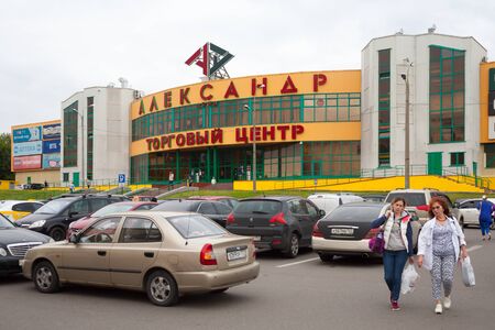 MOSCOW, RUSSIA - JULY 24, 2018: Alexander Land shopping mall, car parking and people in Prishvina Street. This street is located in Bibirevo district of Moscow.のeditorial素材