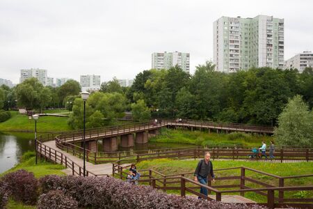 MOSCOW, RUSSIA - JULY 24, 2018: Bibirevo Ethnographic Village Park, people and houses in Belozerskaya Street. This street is located in Bibirevo district in North East of Moscow.のeditorial素材