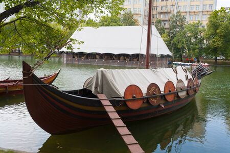 MOSCOW, RUSSIA - AUGUST 15, 2018: Vikings's boat on Chistye Prudy pond.  Chistye Prudy pond or Clean Ponds is Moscow landmark.のeditorial素材