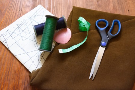 macro composition fabric for sewing sartorial meter measuring tape scissors chalk threads patterns schemesの写真素材