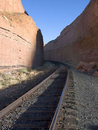 An unsympathetic landscape yields to the railroad near Moab, Utahの写真素材