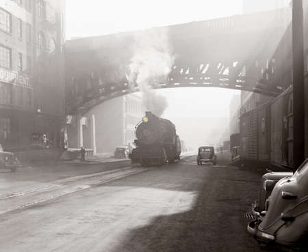 Locomotive on the street in depression era Cincinnati, Ohio