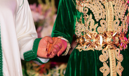 Close up of moroccon couple's hands at a wedding, concept of marriage, moroccan weddingの写真素材