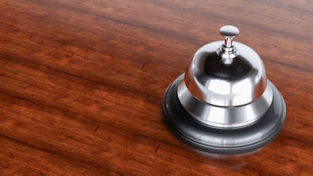 3d render of chrome Reception bell isolated on wooden background, hotel bellの写真素材