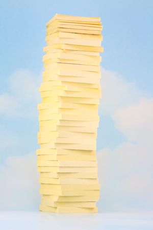 Tower of sticky notes on sky and clouds backgroundの写真素材